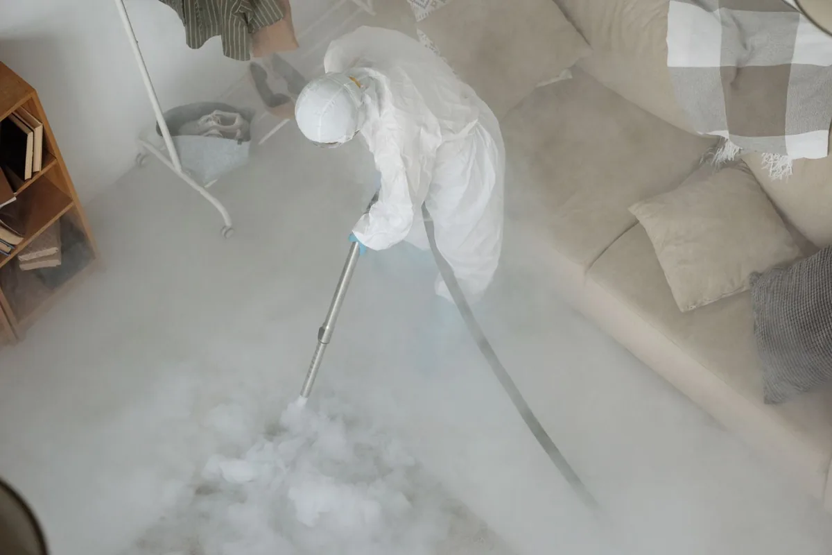 Biohazard cleanup technician in protective equipment, New Roads, LA